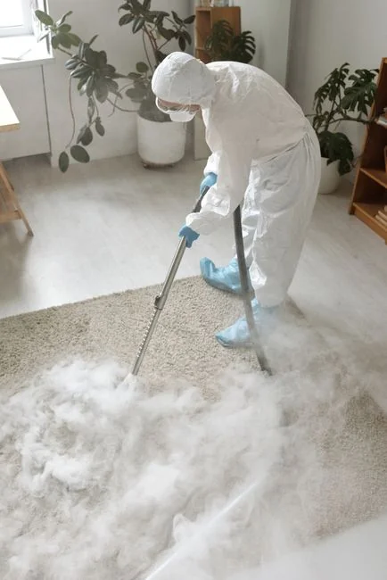 Asian couple having fun while cleaning their home, enhancing a cheerful atmosphere.
